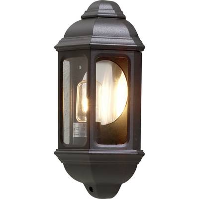 Zewnętrzna lampa ścienna zamontowana na wolnym powietrzu, z włączoną żarówką, umieszczona w czarnej metalowej ramie i przeszklonych panelach, zapewniająca ciepłe, przytulne oświetlenie.