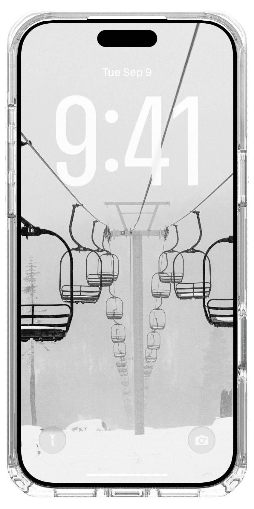 Smartfon wyświetla monochromatyczny obraz krzeseł wyciągu narciarskiego na śnieżnym tle. Godzina '9:41' jest wyraźnie pokazana u góry ekranu.