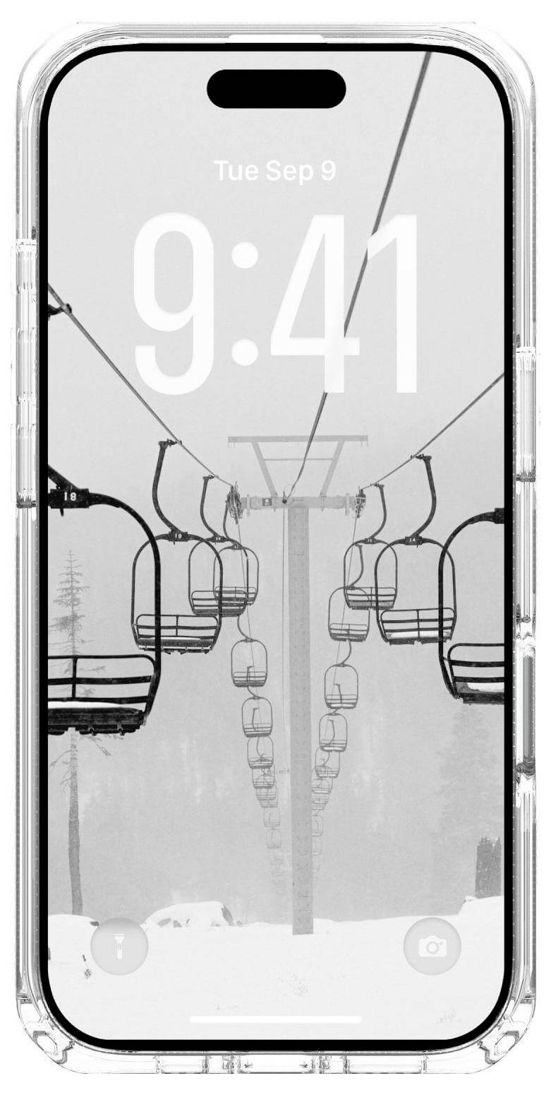 Smartfon wyświetlający 'Wt 9 wrz' i '9:41' na tle czarno-białego obrazu pustych krzeseł wyciągu narciarskiego zawieszonych nad śnieżnym krajobrazem.