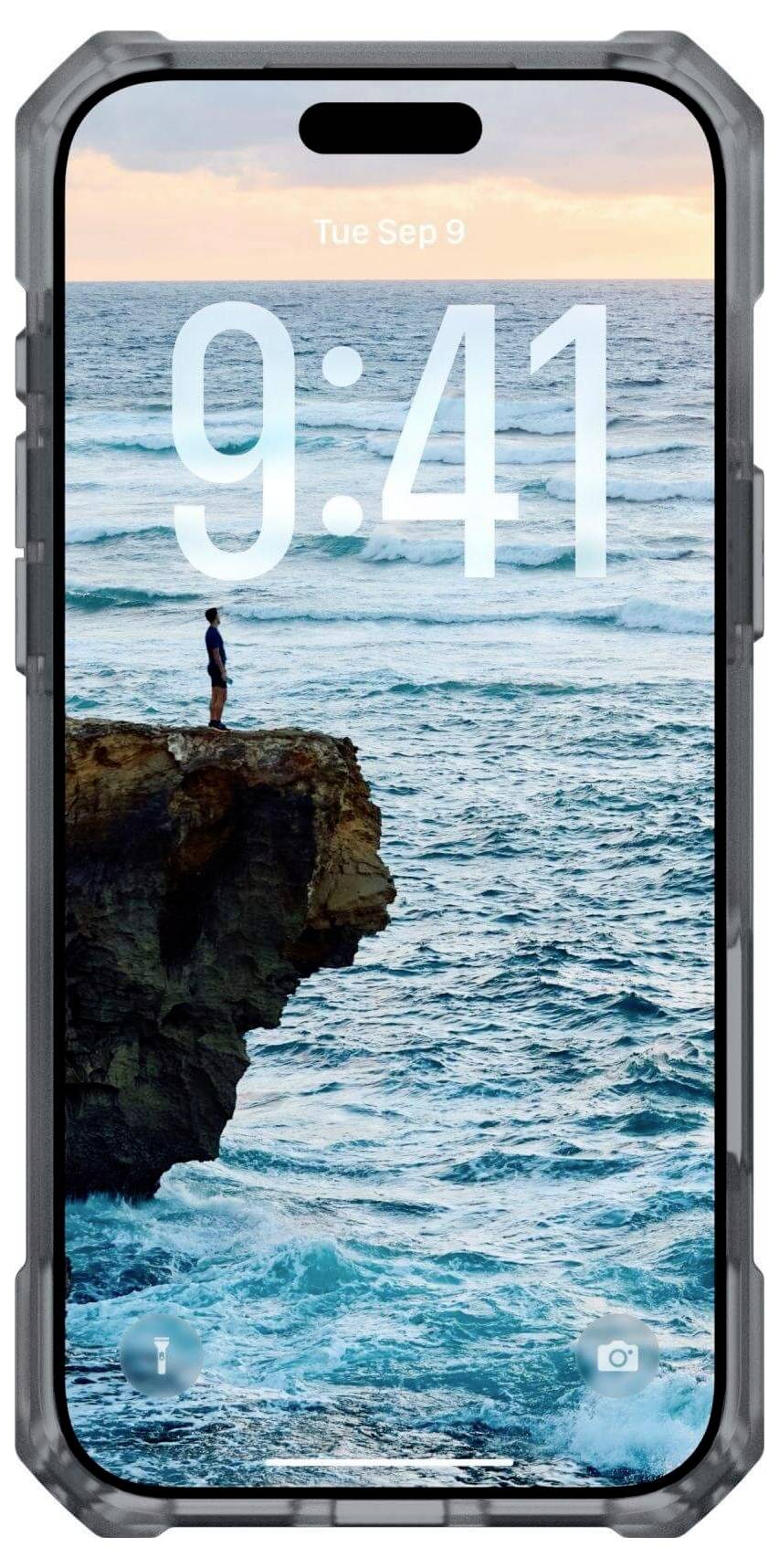 Smartfon wyświetlający ekran blokady z godziną '9:41' i malowniczym widokiem na ocean. Osoba stoi na krawędzi klifu nad morzem.