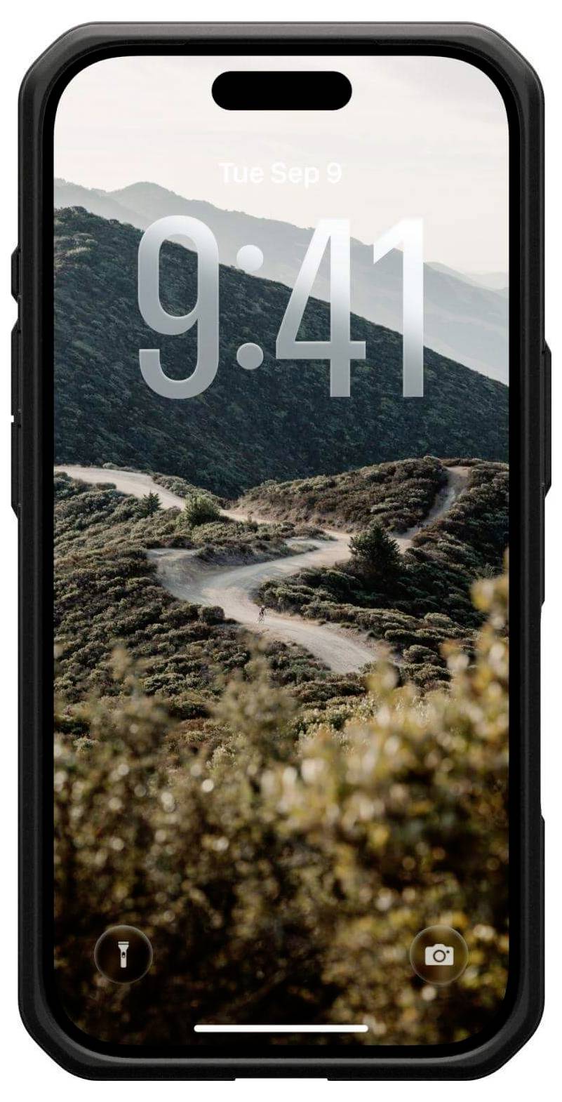 Na smartfonie wyświetla się ekran blokady z godziną '9:41' i datą 'Wt wrz 9'. W tle widać wijącą się drogę górską pod czystym niebem.