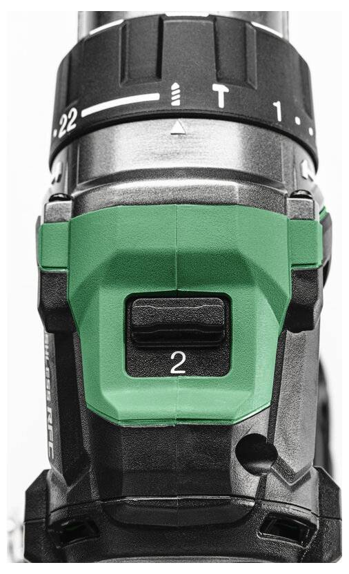 Zbliżenie górnej części wiertarki, prezentujące jej obudowę w kolorach zielonym i czarnym, z oznaczonym ustawieniem prędkości na '2' oraz różnymi ustawieniami momentu obrotowego.