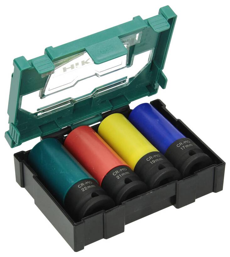 Zielony plastikowy futerał z czterema kolorowymi cylindrycznymi tulejami: czerwoną (21 mm), żółtą (19 mm), niebieską (17 mm) i zieloną (22 mm), stosowany do ochrony przed uderzeniami.