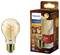 Żarówka LED Philips w stylu vintage wraz z opakowaniem. Żarówka emituje ciepłe, płomieniowe światło; 3W odpowiada 25W żarówce żarowej, generując 270 lumenów.