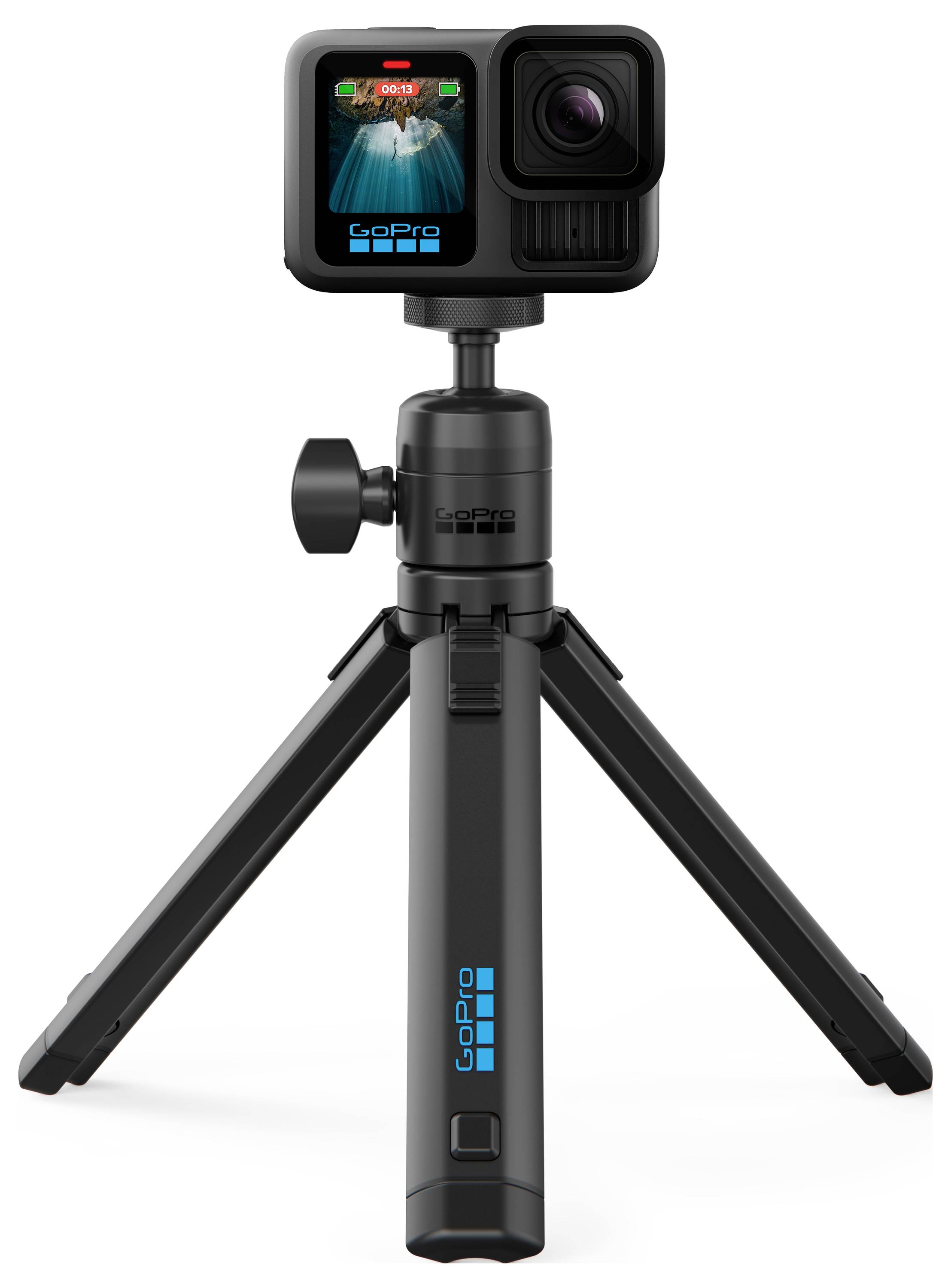 Czarna kamera GoPro zamocowana na kompaktowym statywie, wyświetlająca żywy krajobraz miasta na swoim ekranie.