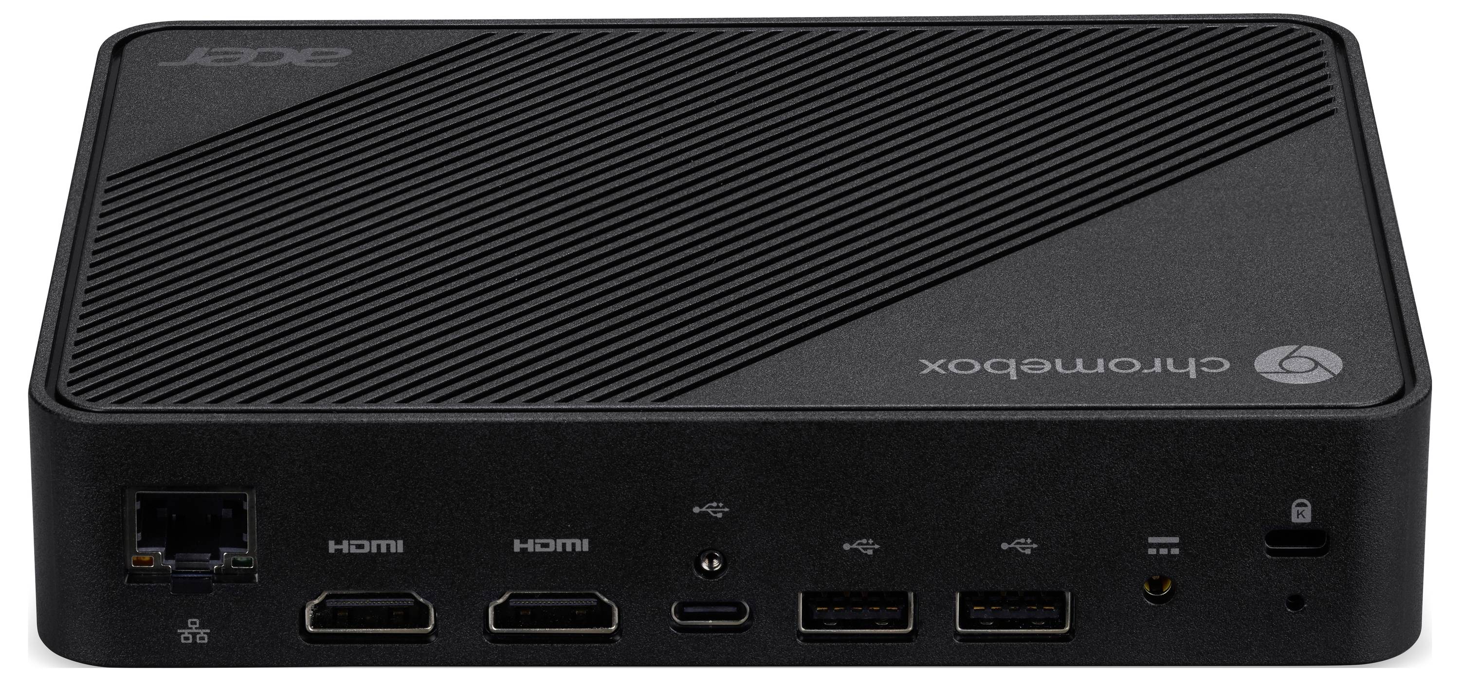 Kompaktowa czarna skrzynka komputerowa z etykietą 'Chromebox', wyposażona w liczne porty, w tym HDMI, USB i Ethernet, na przedniej stronie.