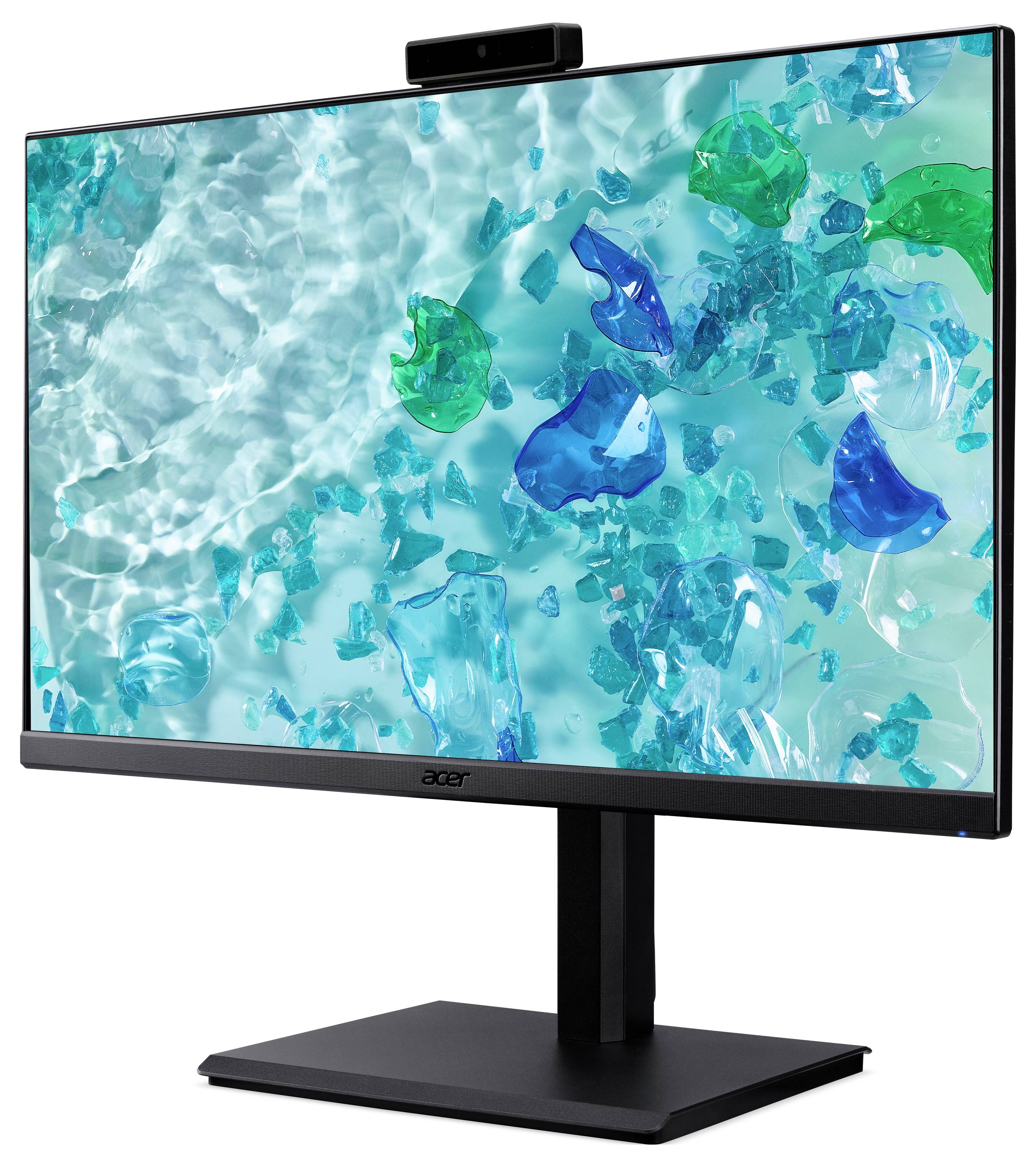 Panoramiczny monitor wyświetla żywy tapeta w kolorze aqua z pływającymi zielonymi i niebieskimi szklanymi kształtami nad falującą wodą.