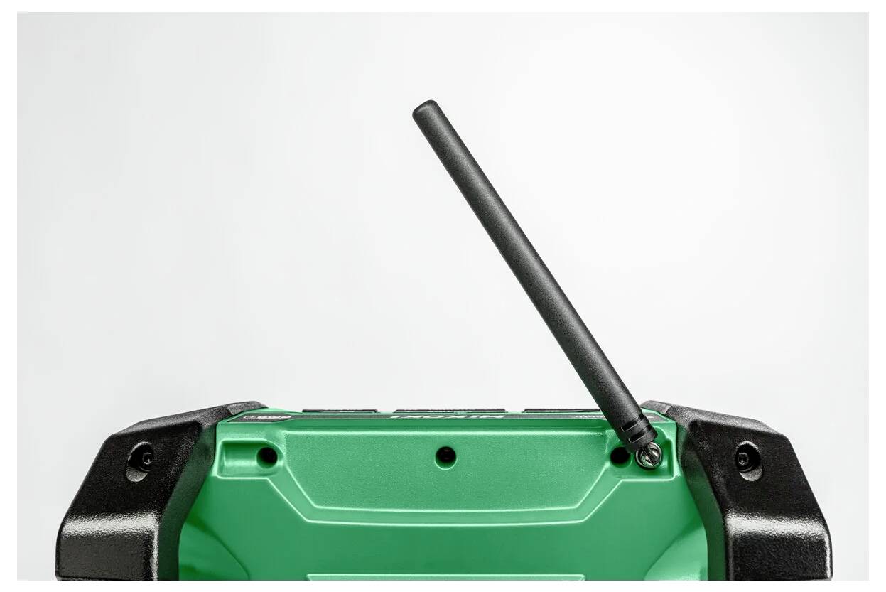 Zielone urządzenie bezprzewodowe z czarną anteną skierowaną w górę. Urządzenie ma czarne narożniki i jest widoczne z perspektywy góry i przodu.