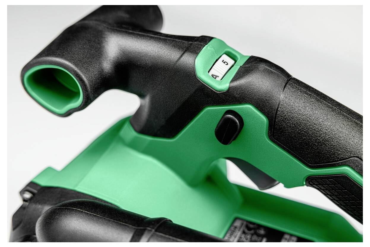 Czarno-zielony uchwyt elektronarzędzia z widocznym przełącznikiem i ponumerowanym pokrętłem, prawdopodobnie służącym do regulacji prędkości lub ustawień.