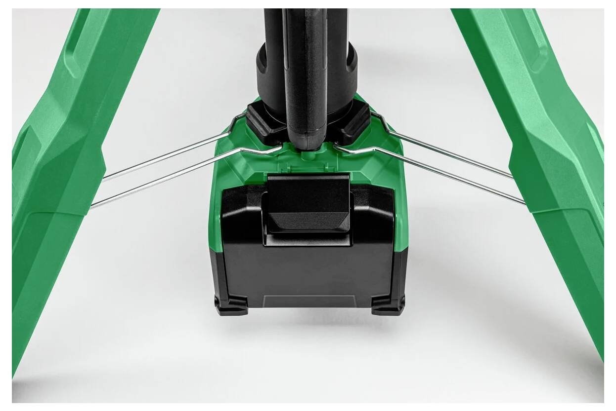 Zbliżenie zielonej podstawy statywu z solidnymi nogami i czarnym mechanizmem centralnym. Zaprojektowany z myślą o stabilności i wsparciu, odpowiedni dla różnych urządzeń.