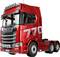 Czerwona ciężarówka Scania z naklejką '770' na boku, prezentująca swój nowoczesny design i solidną budowę.