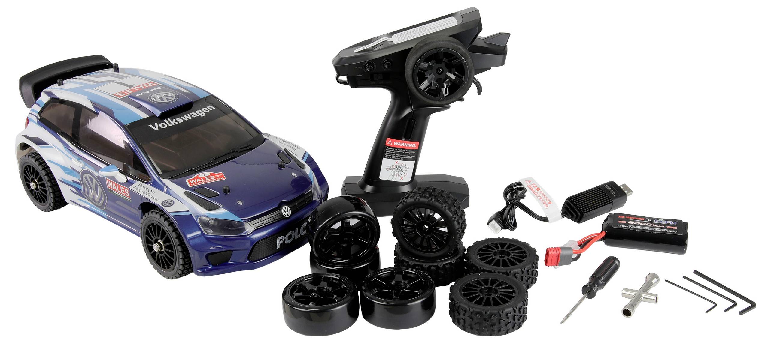 Zestaw zabawkowego samochodu Volkswagen w kolorach niebieskim i czarnym, zawierający pilot zdalnego sterowania, dodatkowe koła, akumulator, ładowarkę USB oraz mały zestaw narzędzi.