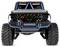 Zdalnie sterowany model Forda Bronco z terenowymi oponami, szczegółowo wykonanym grillem i oznakowaniem 'Ford Performance' na przedniej szybie.