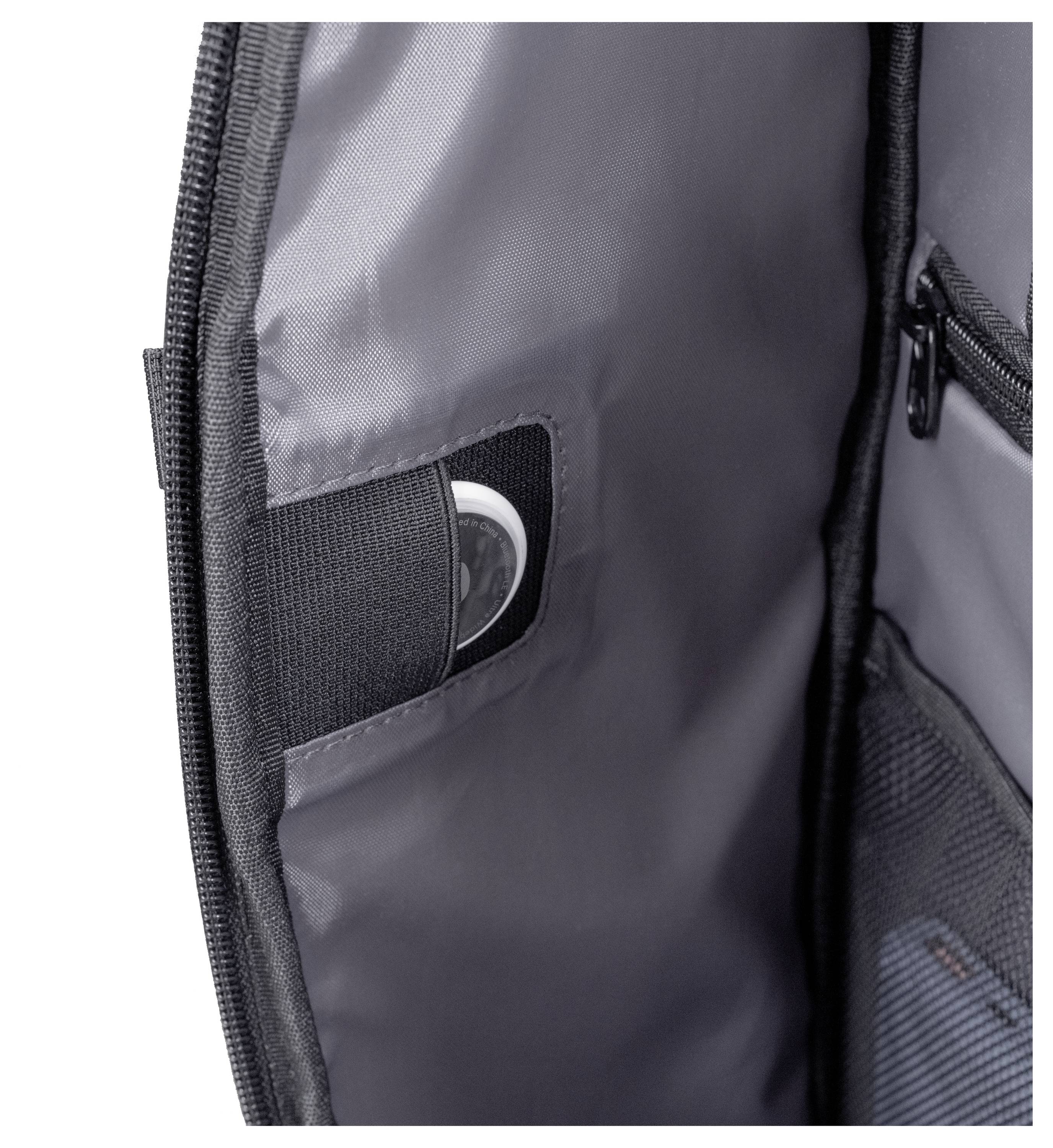 Wnętrze torby z widoczną kieszenią, w której częściowo widać okrągłe urządzenie elektroniczne, podkreślające funkcję przechowywania.