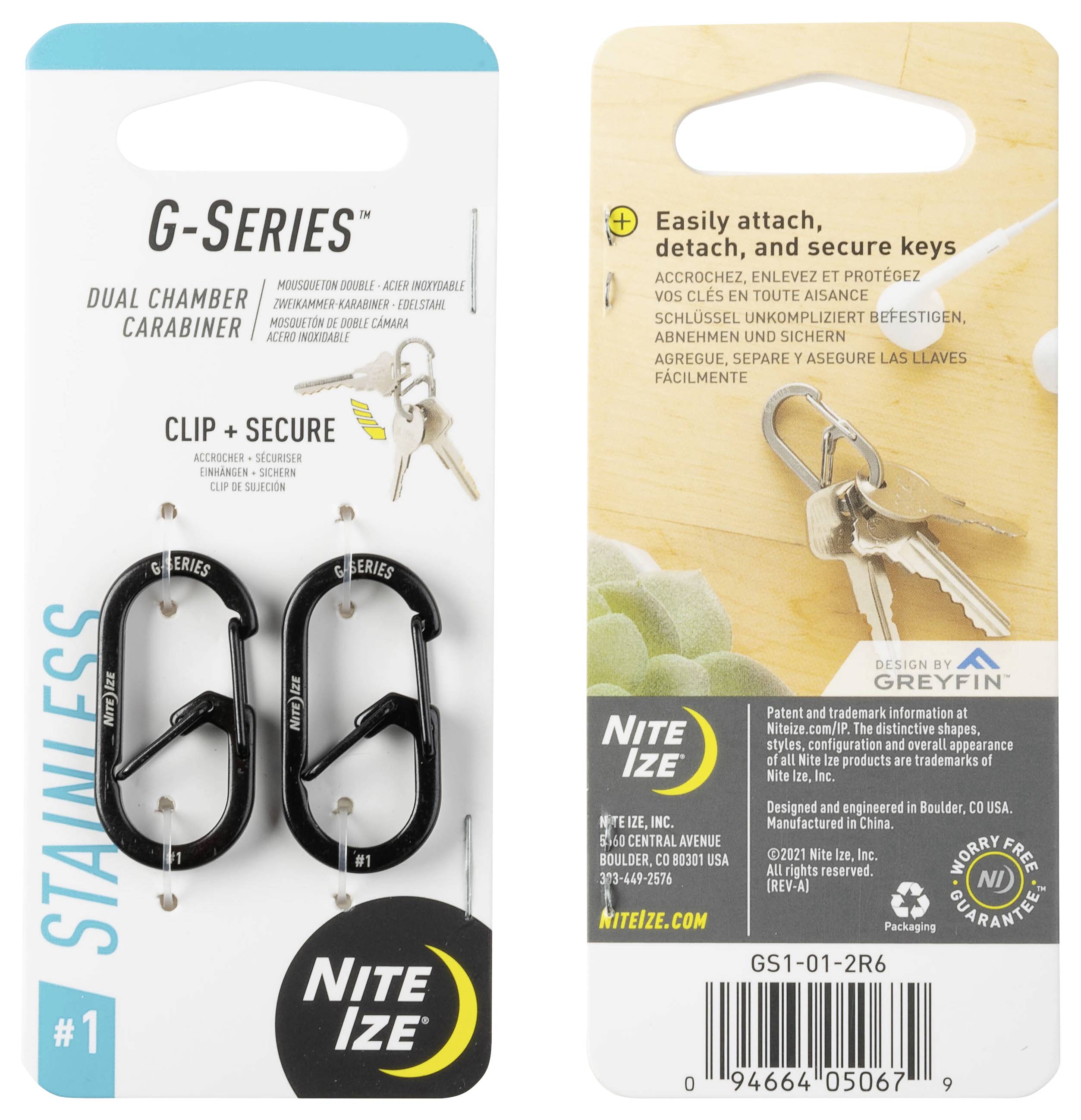 Karabinek z serii G o podwójnej komorze posiada design z zapinką. Na opakowaniu widoczne są karabinki i klucze. Tekst opisuje łatwe przypinanie i odpinanie.