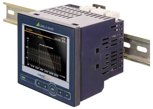 Zamontowane urządzenie elektroniczne z wyświetlaczem cyfrowym, prezentujące wykres fali zatytułowany 'Próbki', przedstawiający zmiany w czasie.