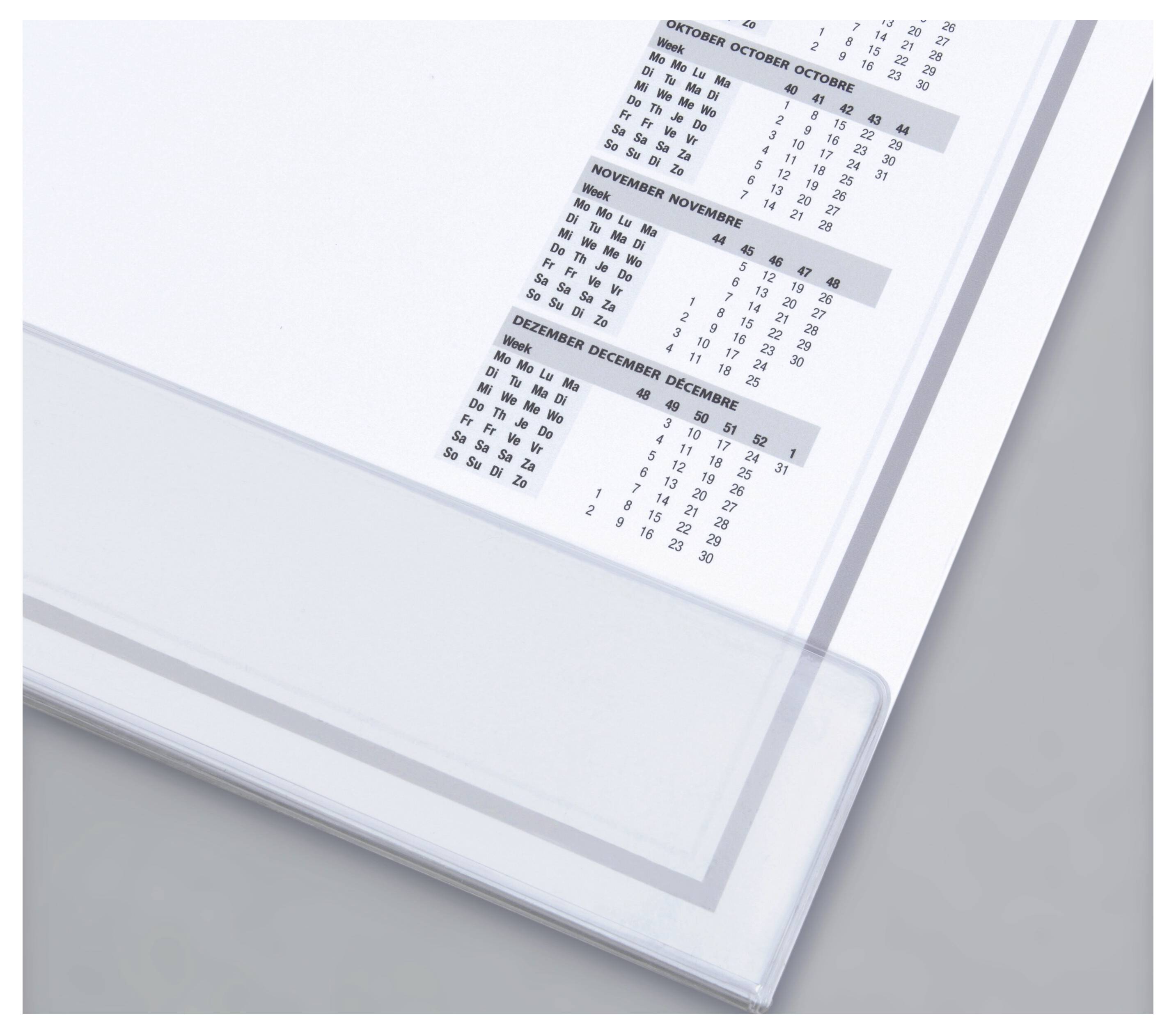 Zbliżenie strony kalendarza przedstawiającej miesiące od października do grudnia z datami, wyświetlone na jasnoszarym tle.