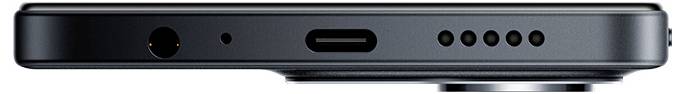 Zbliżenie dolnej krawędzi smartfona przedstawiające porty i otwory głośnika.