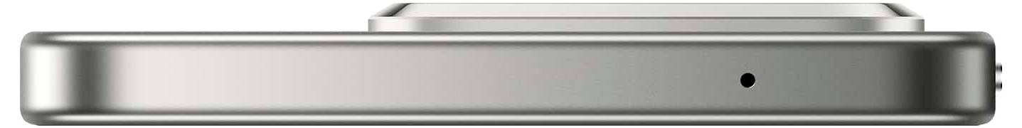 Smukły metalowy przyrząd o gładkich krawędziach, posiadający małą okrągłą kratkę na przedniej stronie.