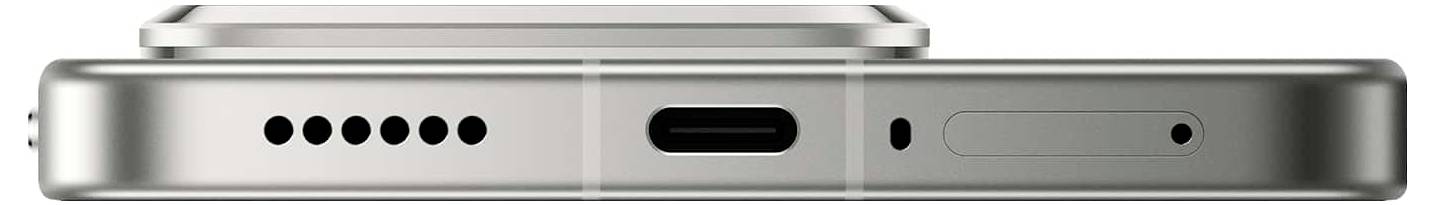 Widok z boku srebrnego smartfona przedstawiający otwory głośnika, port ładowania USB-C oraz gniazdo karty SIM.