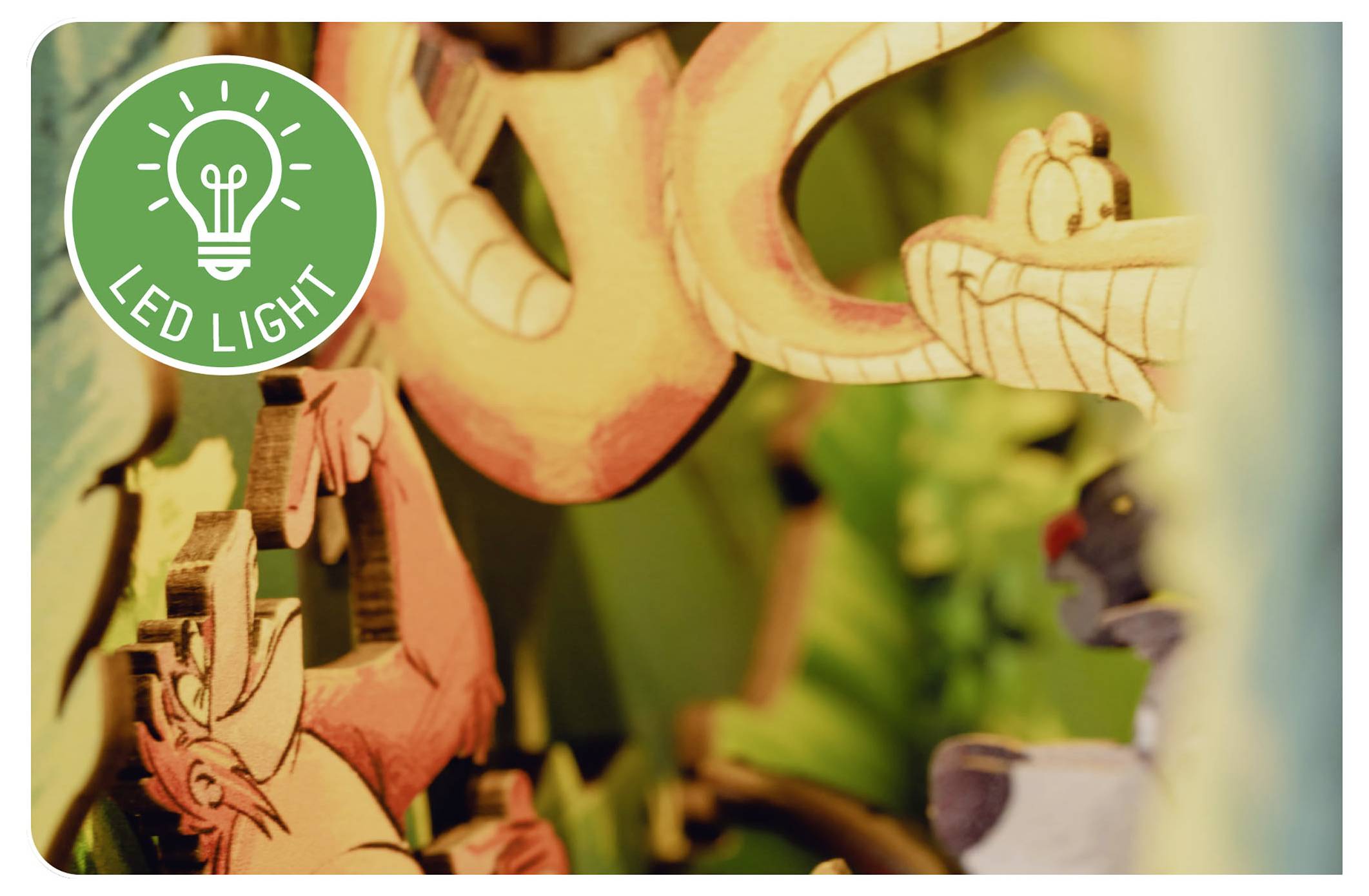 Kolorowa abstrakcyjna ilustracja przedstawia zabawne postacie zwierząt, z zielonym kołem w rogu zawierającym ikonę żarówki oraz tekst 'Światło LED'.