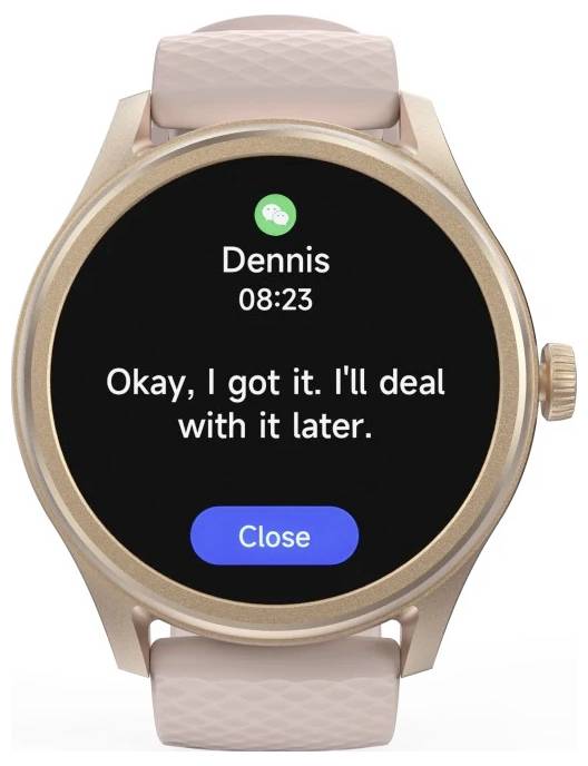 Smartwatch wyświetlający wiadomość od Dennisa, odebraną o 08:23, z treścią „Dobrze, rozumiem. Zajmę się tym później." oraz przyciskiem „Zamknij".