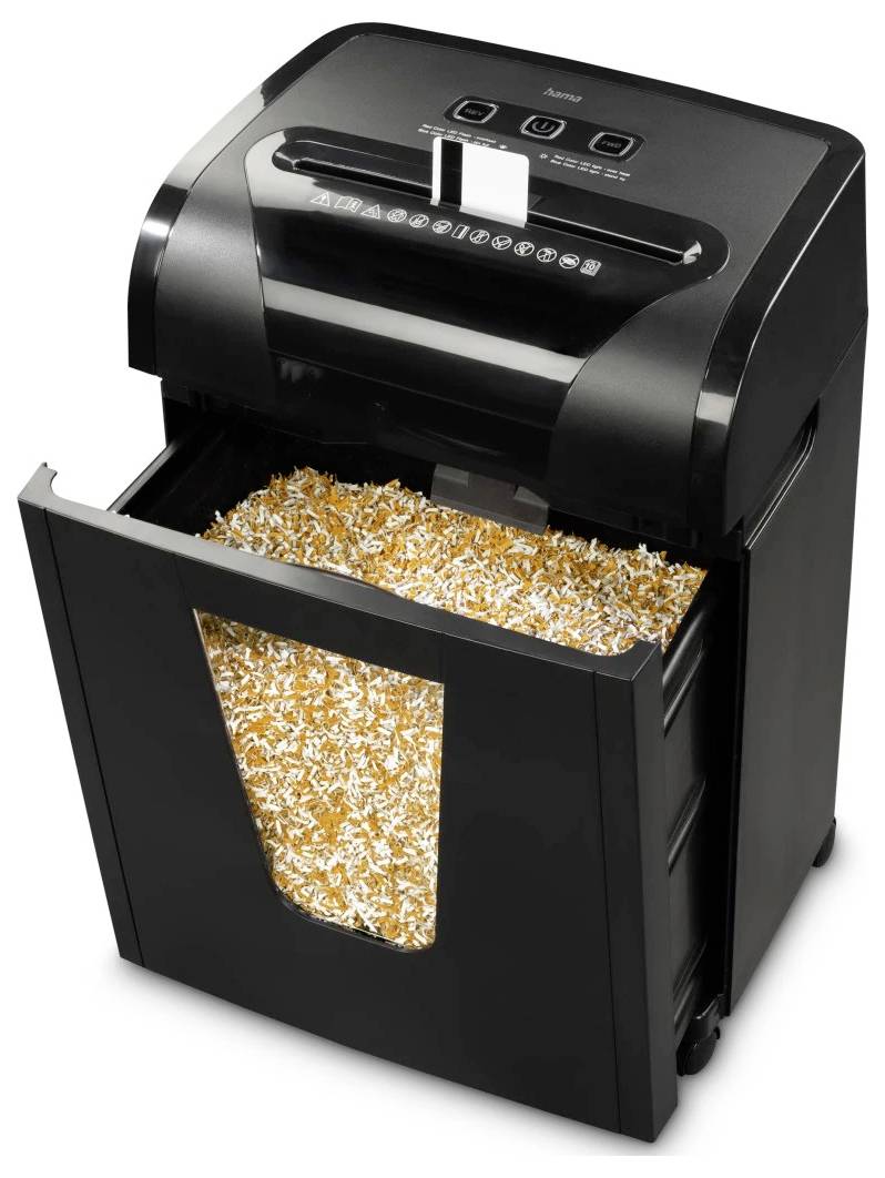 Czarny niszczarka dokumentów, przez przezroczyste okienko z przodu kosza widać proces niszczenia papieru.