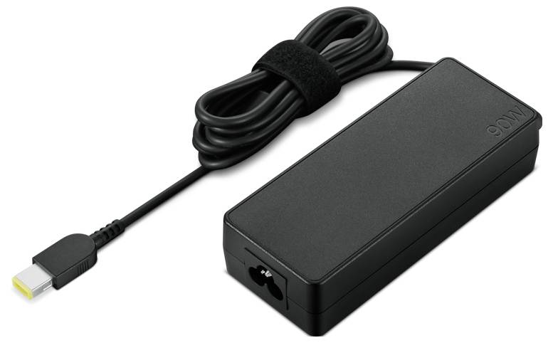 Czarny zasilacz do laptopa z długim, spiralnym przewodem i żółtym końcówką, odpowiedni do ładowania urządzeń elektronicznych.