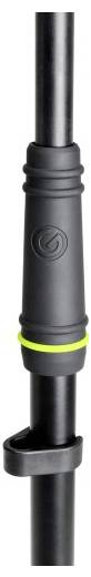 Zbliżenie czarnego pręta z teksturowanym uchwytem i zielonym pierścieniem, z okrągłym logo.