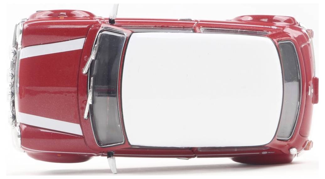 Czerwony samochodzik zabawkowy widziany z góry, prezentujący białe nadwozie i opływowy kształt.