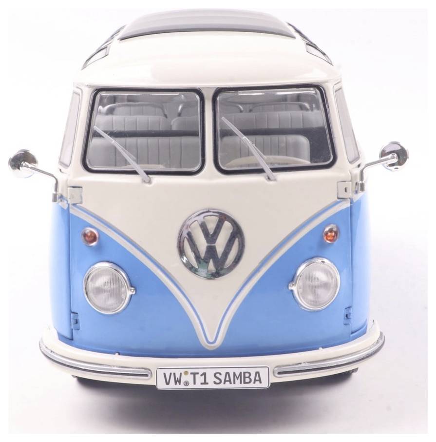 Model zabytkowego niebiesko-białego busa VW T1 Samba, widziany z przodu, przedstawiający jego kultowy design z klasycznym logo i reflektorami.