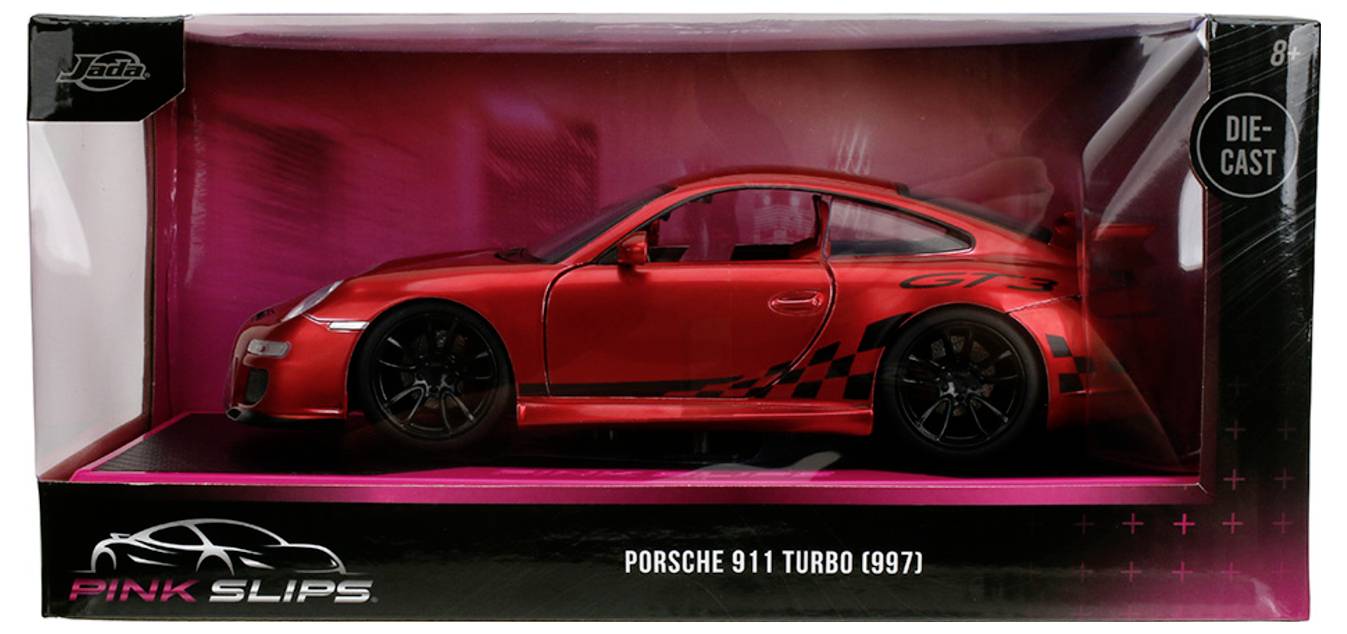 Czerwony model odlewany die-cast Porsche 911 Turbo (997) w pudełku wystawowym z oznakowaniem 'Pink Slips', przedstawiający profil samochodu z czarnymi naklejkami.