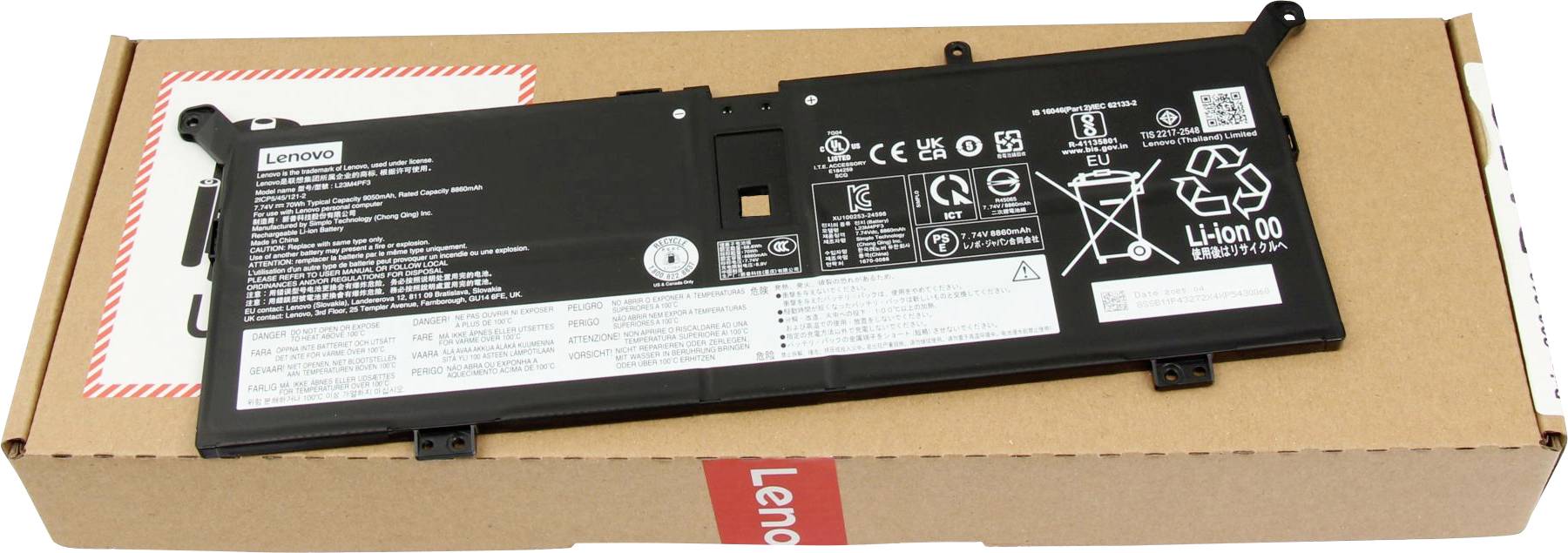 Czarny akumulator do laptopa z różnymi ikonami bezpieczeństwa i tekstem, spoczywający na brązowym kartonie oznaczonym napisem 'Lenovo'.