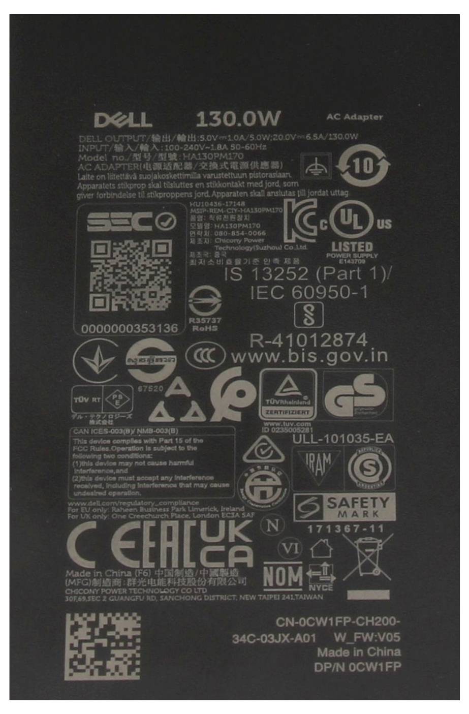 "Zasilacz sieciowy Dell 130W" z wieloma międzynarodowymi symbolami certyfikacji i oznaczeniami bezpieczeństwa, w tym logotypami UL, CE oraz EAC.