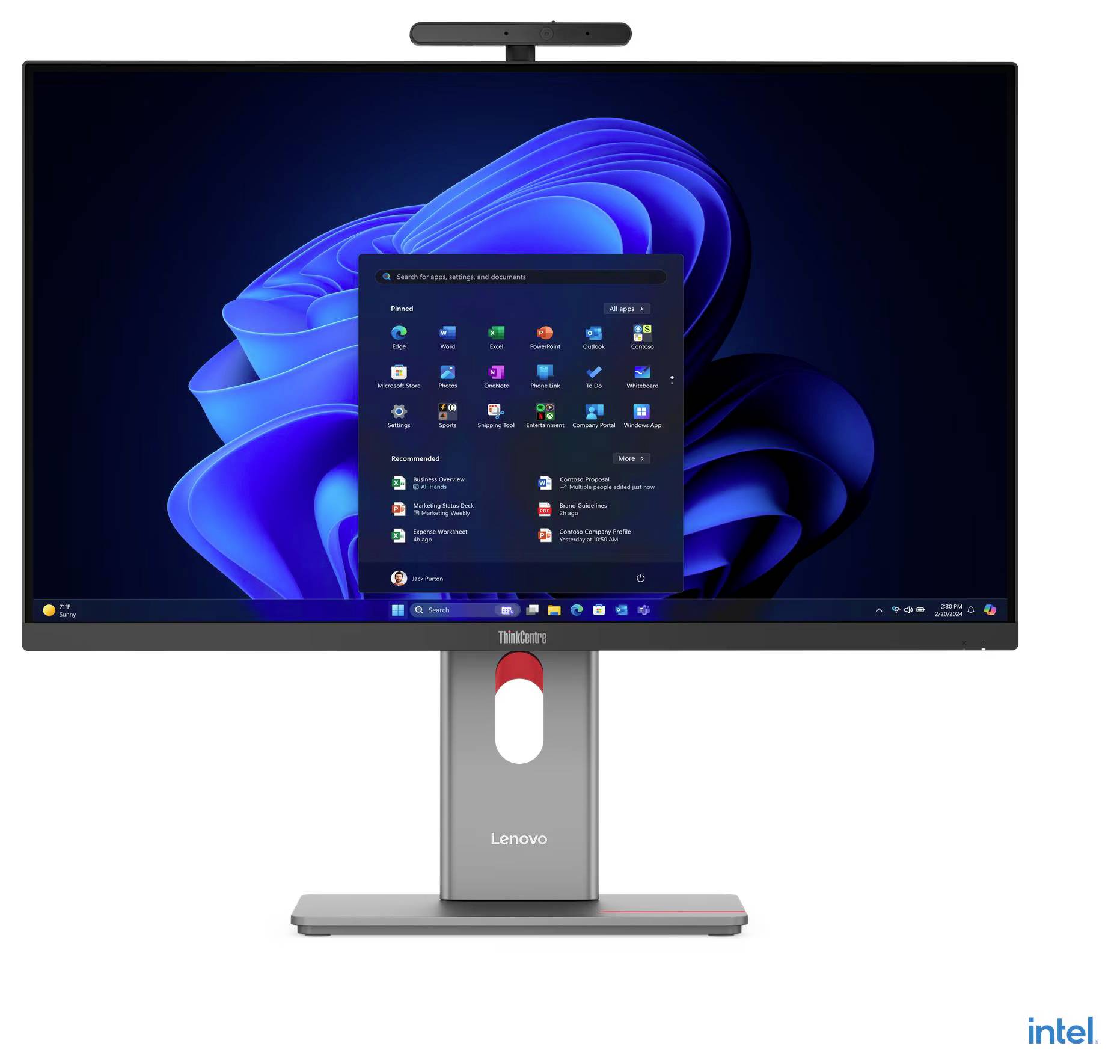 Monitor Lenovo z kamerą do wideokonferencji na górze i wyświetlonym interfejsem systemu operacyjnego Windows, zawierającym pulpit z widocznymi ikonami różnych aplikacji.