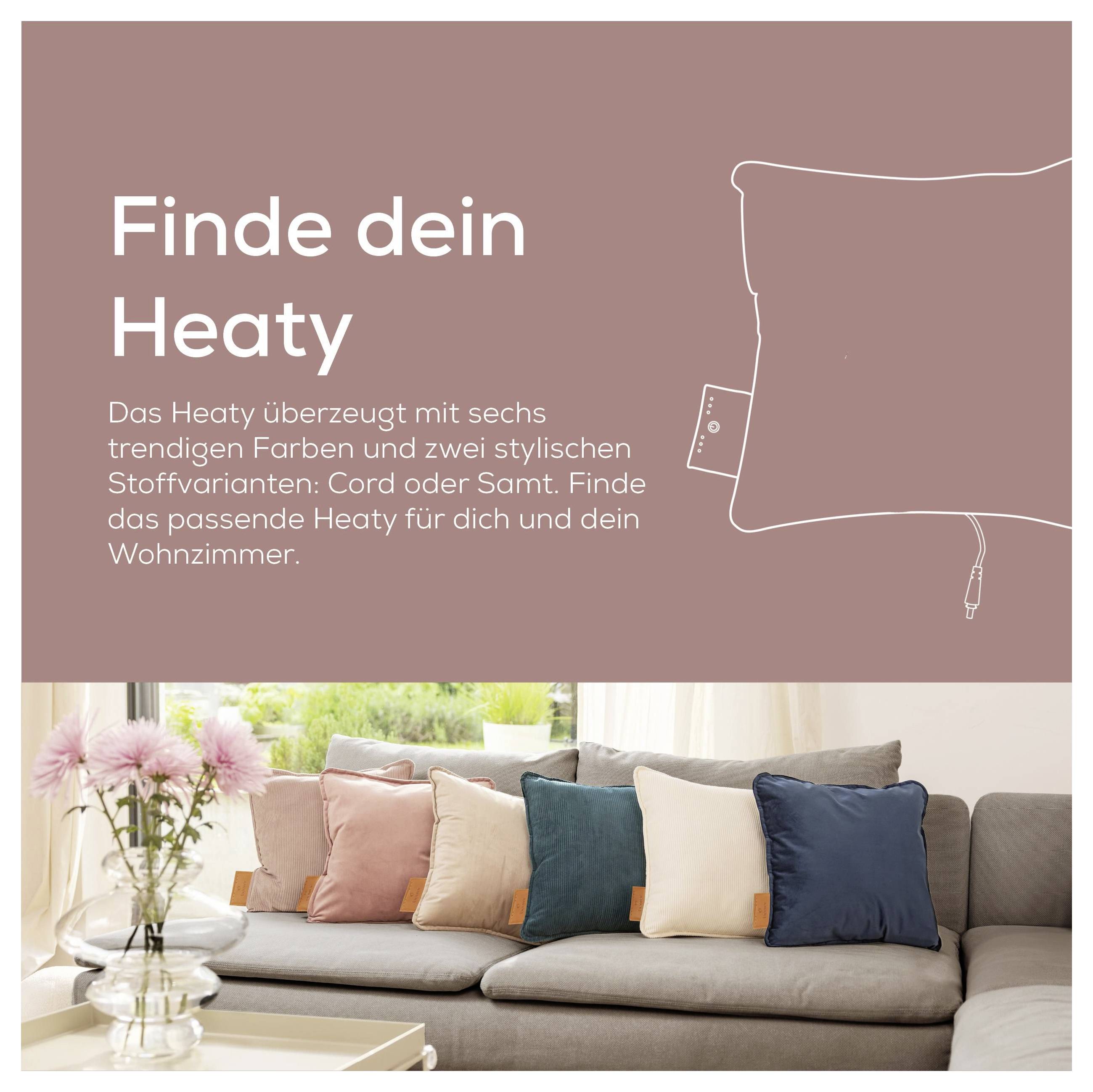 # Sofa z kolorowymi poduszkami w przytulnym salonie. Tekst brzmi „Znajdź swoje Heaty" z opisem Heaty w różnych stylach.