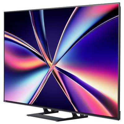 Elegancki telewizor z płaskim ekranem wyświetlający żywe abstrakcyjne wzory w neonowych kolorach na ciemnym tle, prezentujący nowoczesny design.