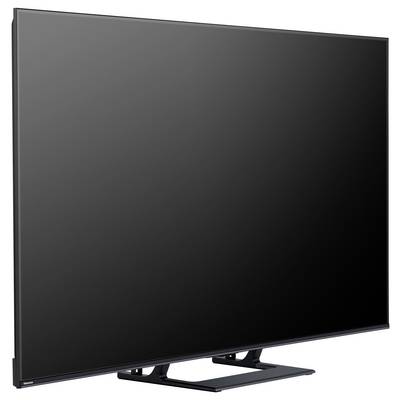 Płaski telewizor z eleganckim, nowoczesnym designem i czarną ramką, umieszczony na stojaku.