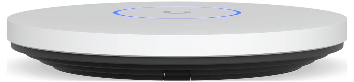 Białe urządzenie Unifi montowane na ścianie ze słabym blaskiem w górnej części środka.