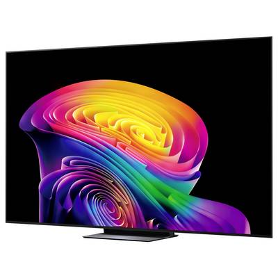 Nowoczesny telewizor z płaskim ekranem wyświetlający żywy abstrakcyjny wir tęczy na czarnym tle.