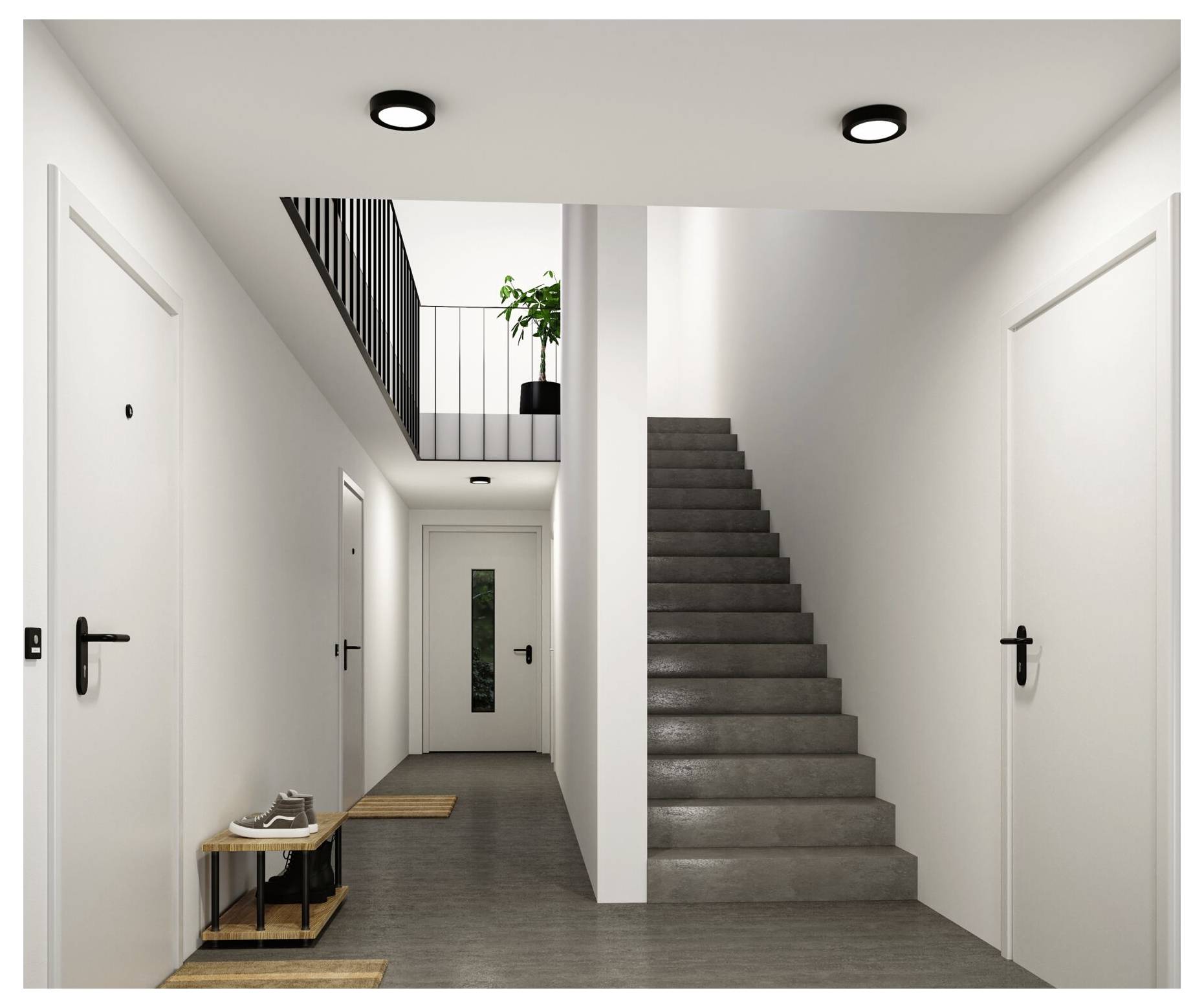 Nowoczesny korytarz apartamentu z białymi drzwiami, szarą podłogą, centralną klatką schodową i małym stolikiem wejściowym z butami i dywanikami.
