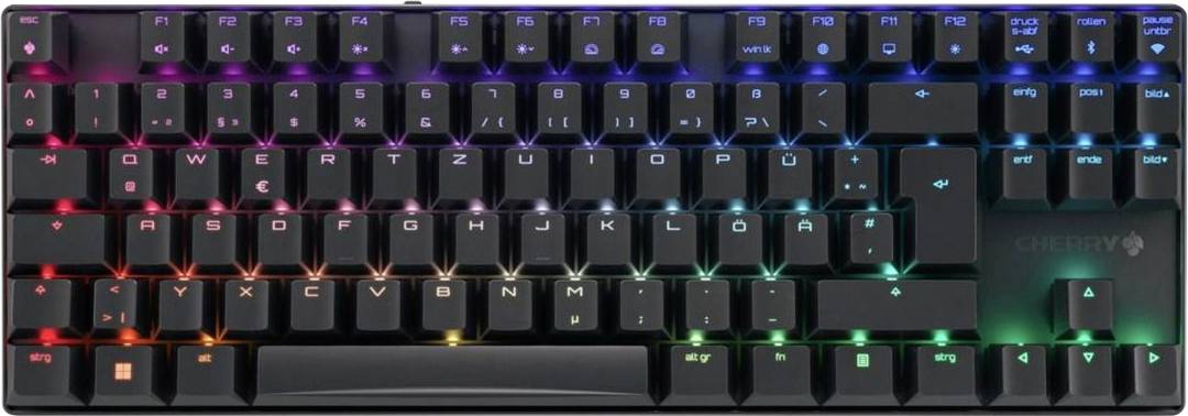 Zbliżenie na podświetlaną klawiaturę gamingową z wielokolorowym oświetleniem RGB na klawiszach.