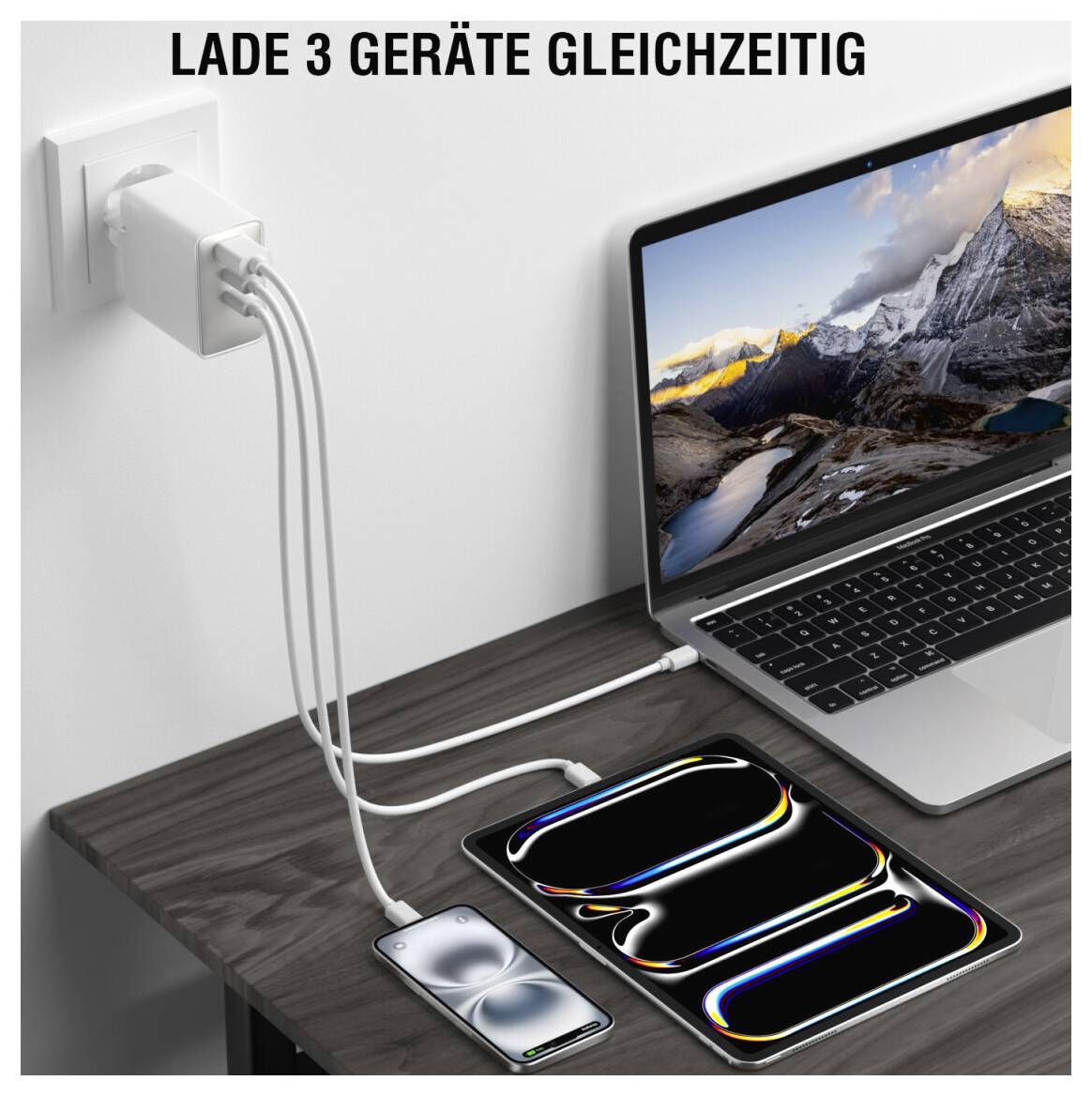 Ładowarka ścienna zasilająca laptopa, tablet i smartfona jednocześnie, z tekstem „ŁADUJ 3 URZĄDZENIA JEDNOCZEŚNIE" u góry.