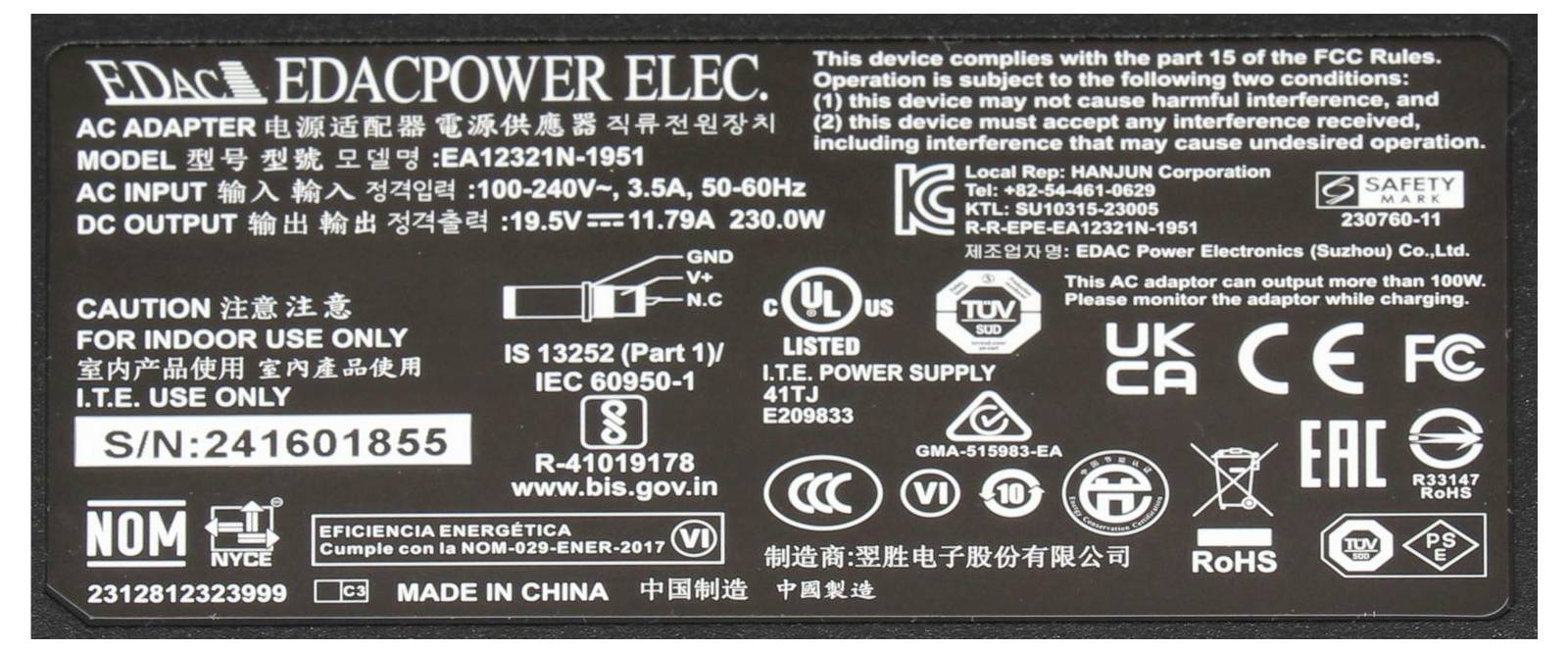 Etykieta na adapter sieciowy EDACPOWER ELEC, model EA12321-1951, wejście 100-240V, wyjście 19,5V 11,79A, z certyfikatami bezpieczeństwa i ostrzeżeniami.