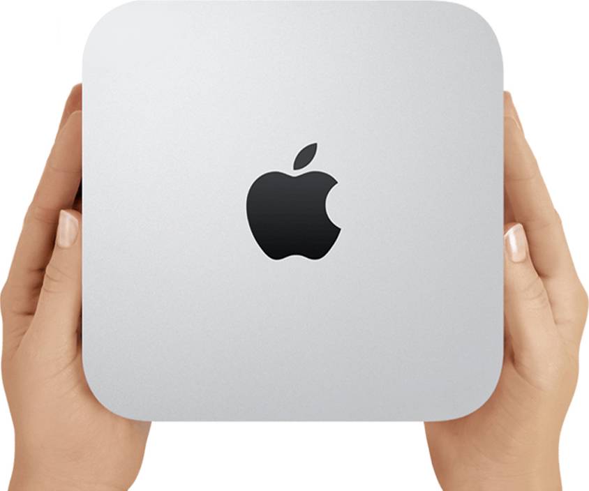 Ręce trzymające srebrny Apple Mac mini z czarnym logo Apple wyśrodkowanym na przedniej stronie.