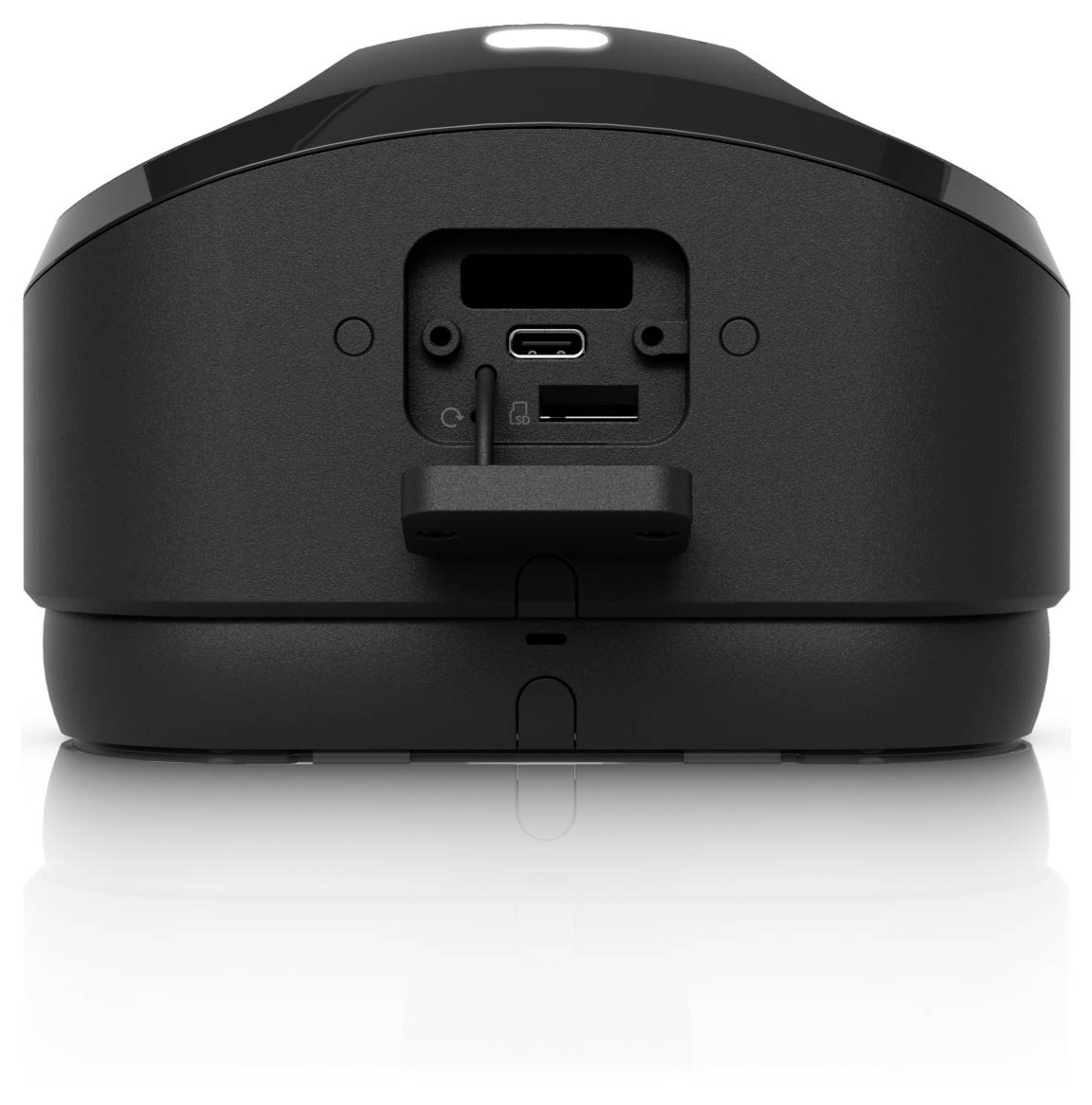Widok z tyłu czarnego urządzenia pokazujący porty USB-C i czytnika kart pamięci, wraz z komorą baterii i błyszczącą podstawą.