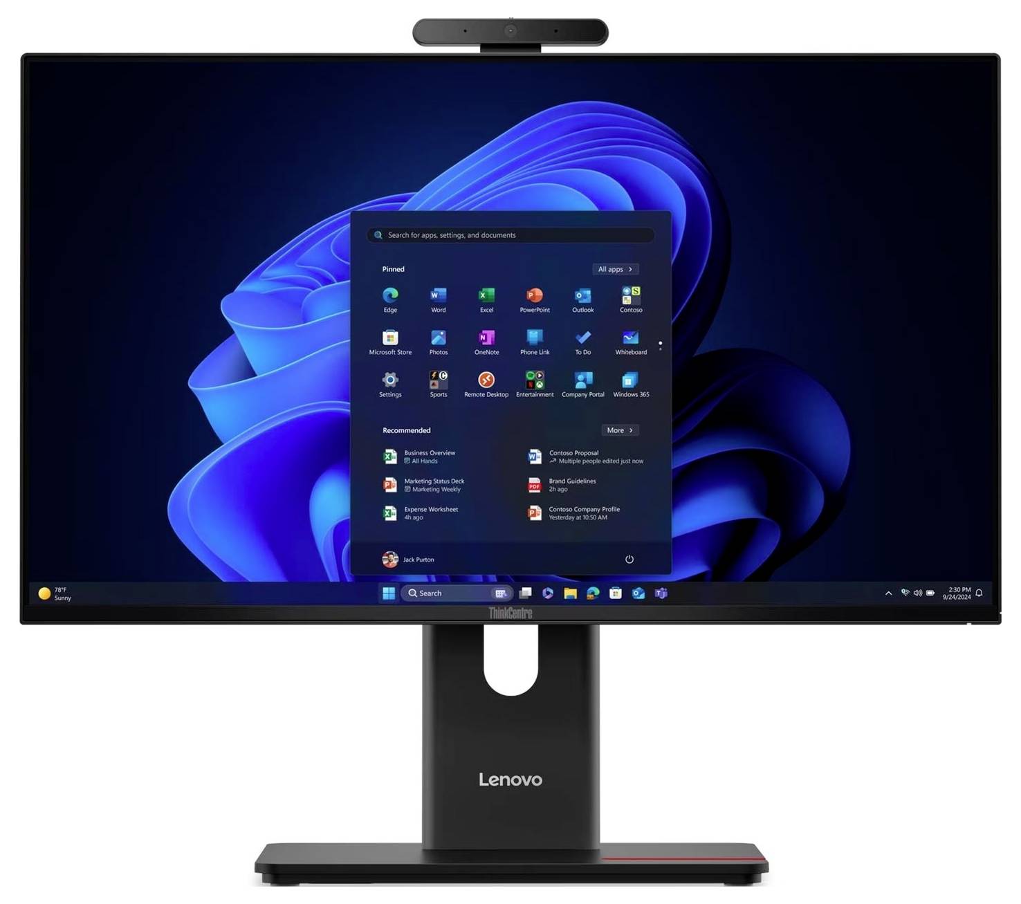 Monitor stacjonarny Lenovo wyświetlający pulpit systemu Windows 11 i wycentrowane menu Start na niebieskim abstrakcyjnym tle, z kamerą internetową na górze i podstawą poniżej.