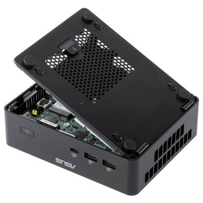 Otwarta czarna obudowa mini PC z uniesioną pokrywą górną, odsłaniającą wewnętrzne obwody i wentylacyjne otwory; widoczne porty frontowe i logo ASUS.