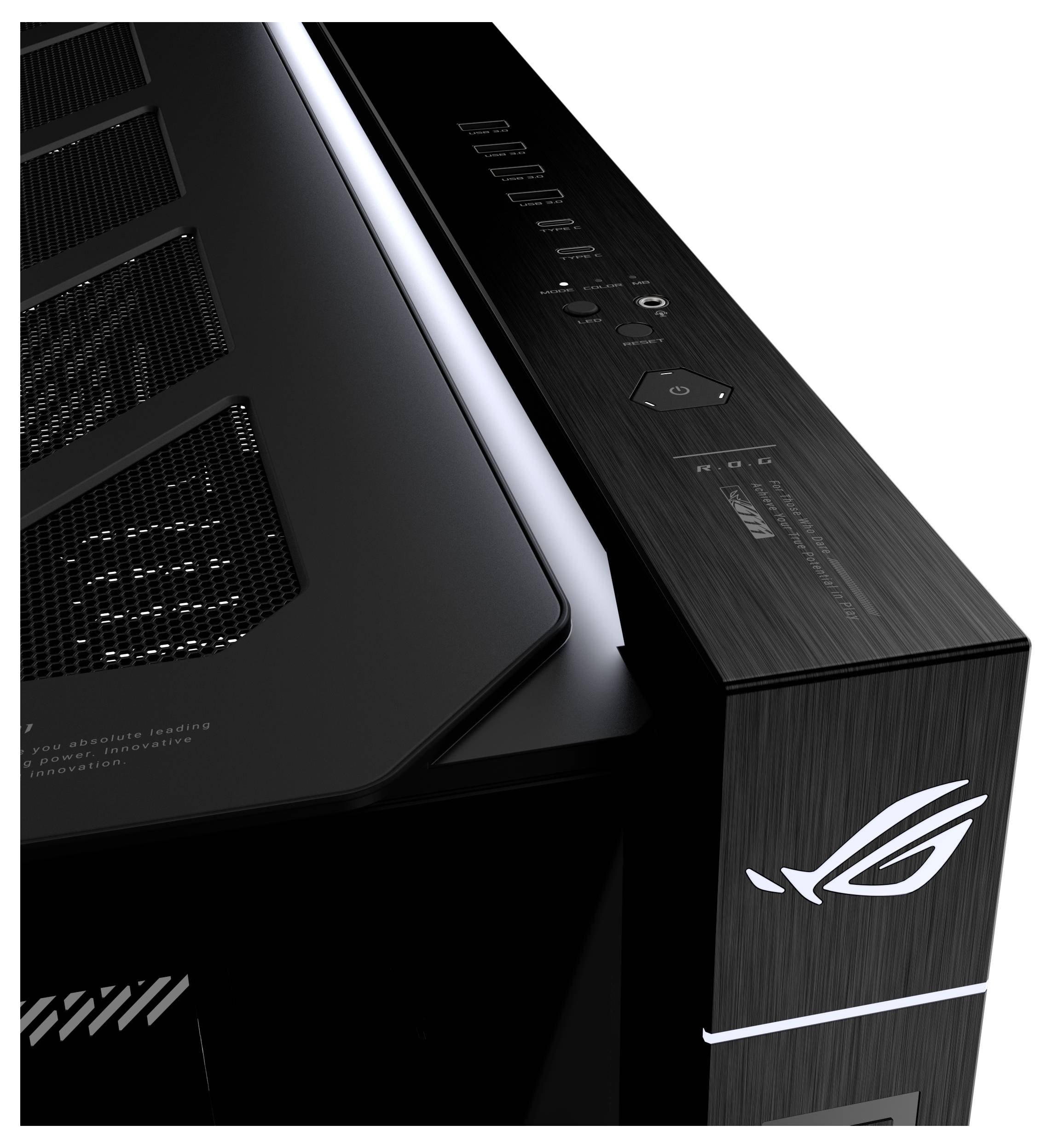 Zbliżenie na czarną obudowę komputera stacjonarnego ASUS ROG z wentylacją siatkową, przyciskami sterującymi na górze i oświetlonym logo Republic of Gamers na przednim panelu.