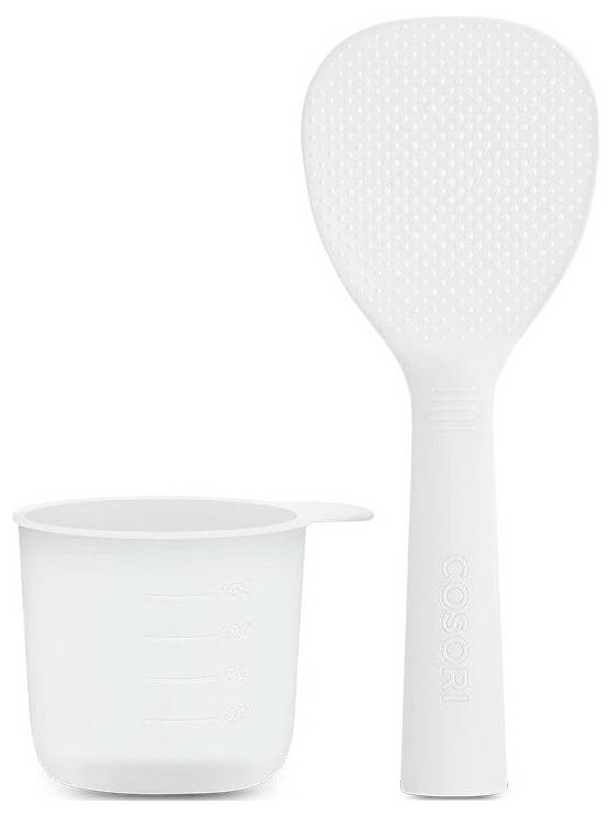 Biały silikonowy pędzel do ciała i miarka do mieszania lub aplikacji płynnego produktu.